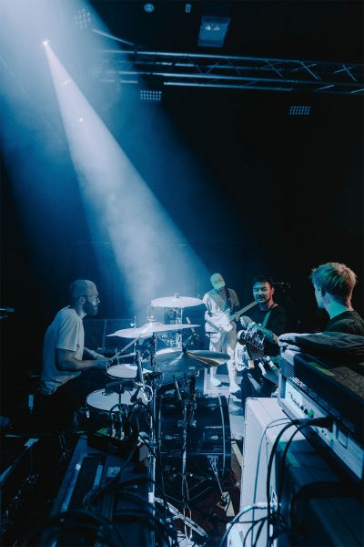 Band looking at each other on stage